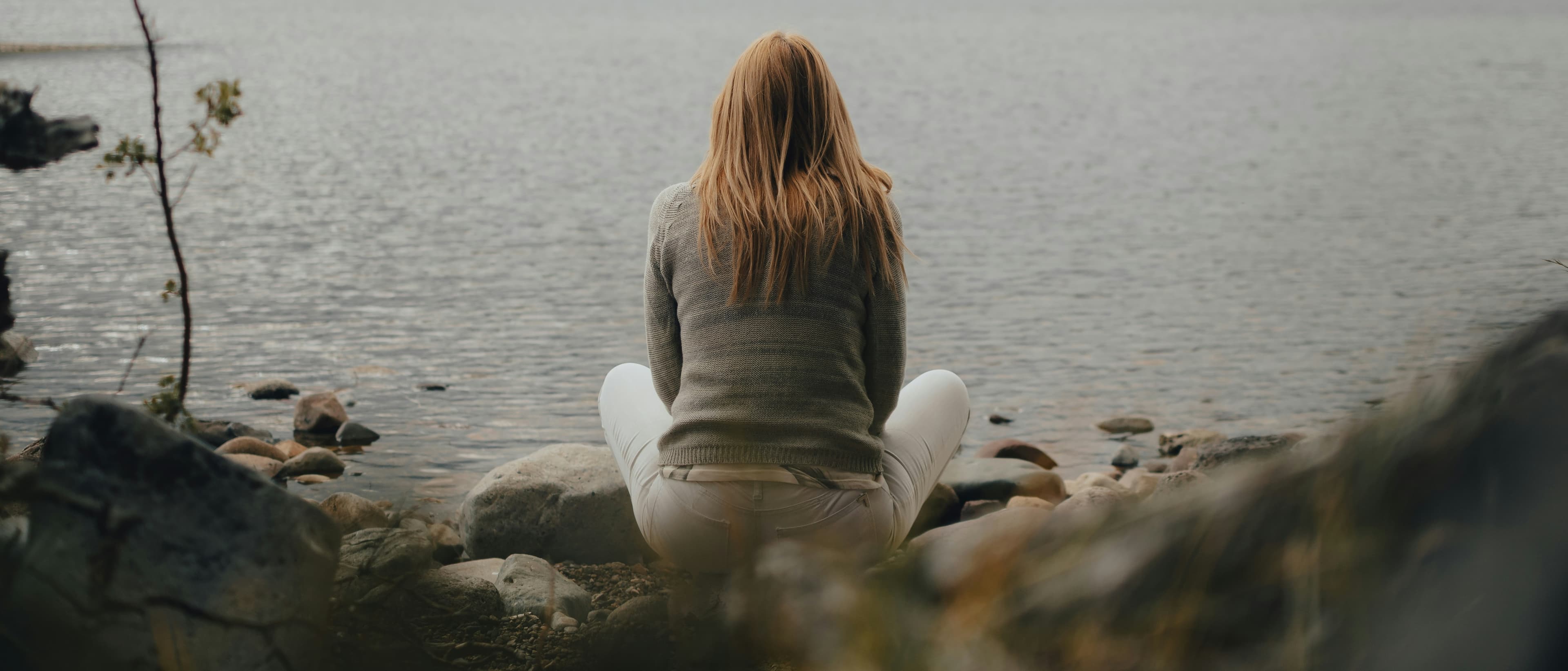 person looking in mirror representing identity exploration journey