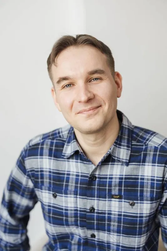 Professional headshot of Yaroslav Grechkin