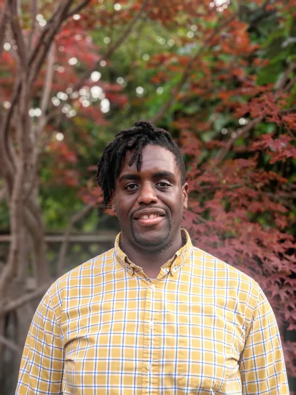 Professional headshot of Kenton Domize