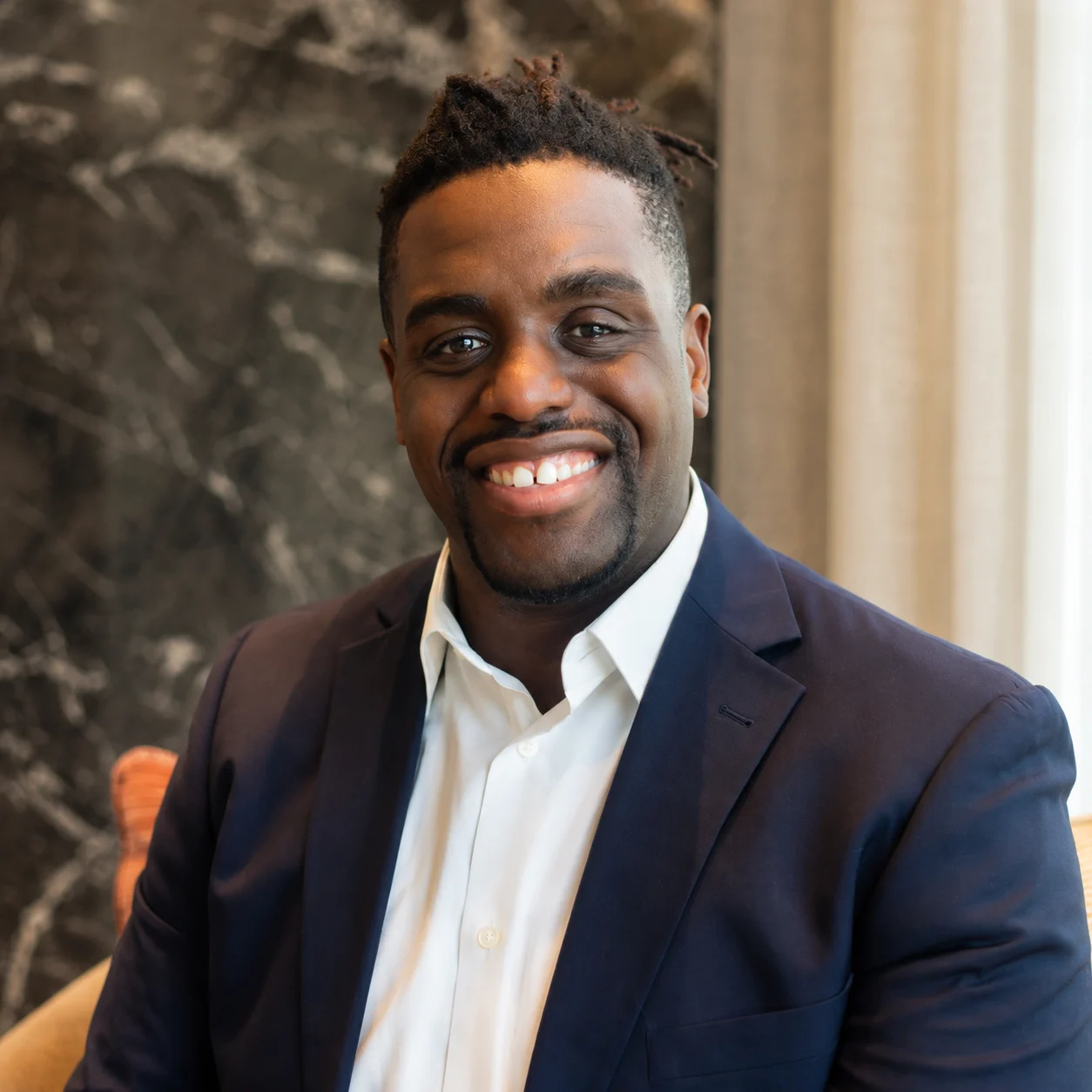Professional headshot of Kenton Domize